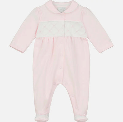 Pink smocked footies with flower embroidery for baby girls crawling and playing