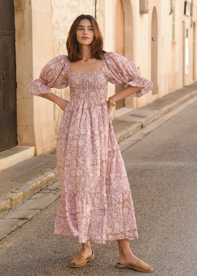 The Amara Dress: Guava - A beautiful knee-length dress in vibrant guava color, perfect for summer events and parties