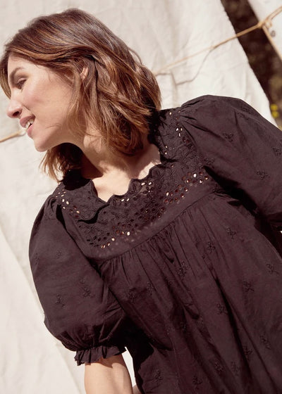 Stylish and elegant Black Harriet Blouse with delicate lace trim and flowy, relaxed fit