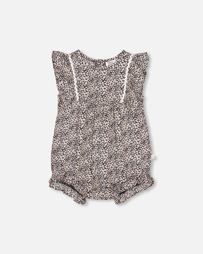 Small Printed Floral Romper with delicate pink and white flowers on a black background, featuring a flattering V-neckline and adjustable spaghetti straps for a comfortable fit