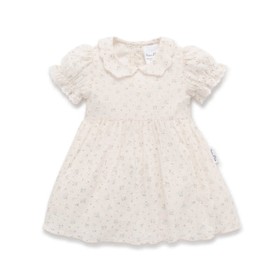 Ivory dress with vintage floral print, scalloped collar, and ruffle puff sleeves for toddlers.