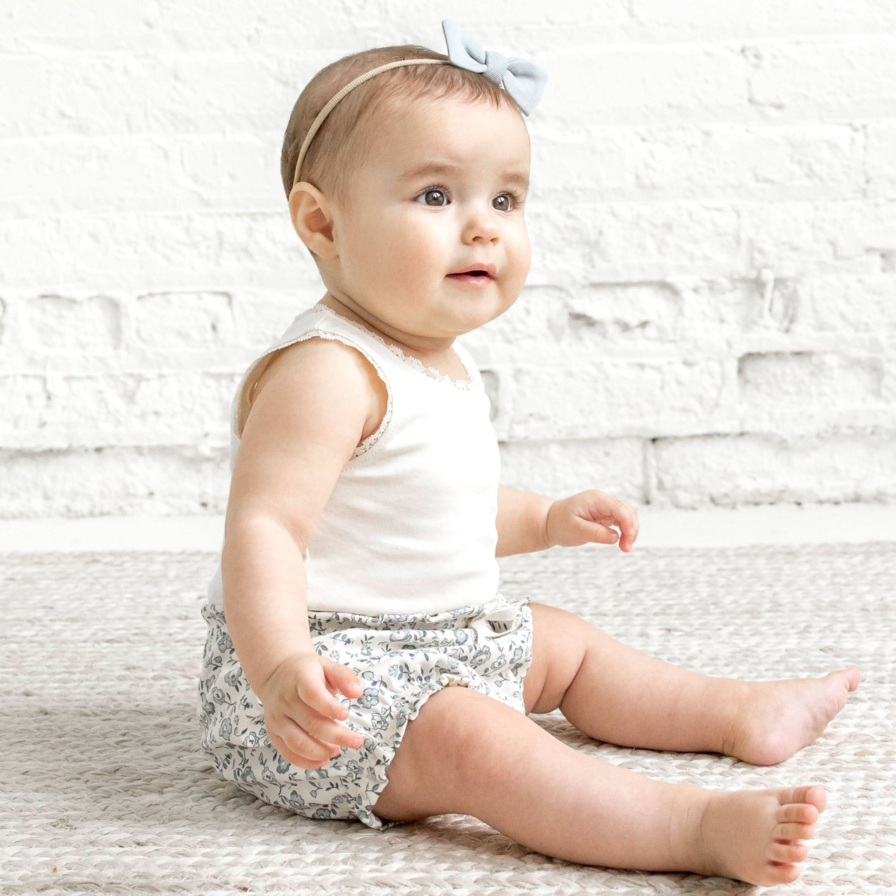 Floral print bloomers with elastic waist and leg openings in a soft organic cotton fabric.