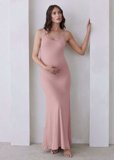 The Cloud Dress in Dusty Rose, a flowing and elegant garment perfect for any special occasion or casual outing, featuring a flattering v-neck and delicate ruffled sleeves