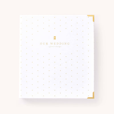 White leatherette wedding planner with gold corners and elegant dot pattern, packaged in a box.