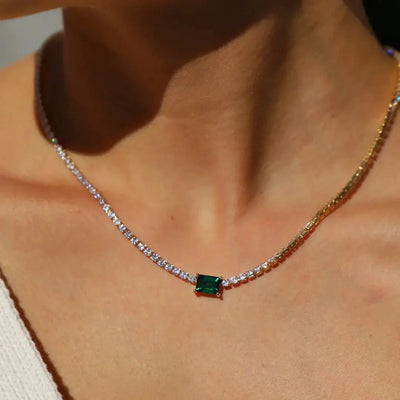 Heirloom emerald necklace with intricate gold filigree and diamond accents