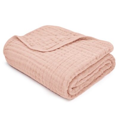 Soft and breathable blush pink baby muslin cotton blanket for cozy snuggles