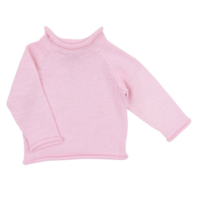 Adorable 18-month-old baby girl wearing a soft pink raglan sweater by Magnolia Baby