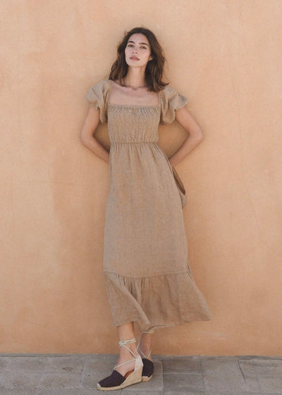 The Soller Dress - Rye, a beautiful and flowy summer dress with a floral print and adjustable straps for a perfect fit