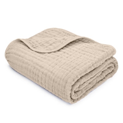 Soft and breathable muslin cotton baby blanket in a sandy beige color