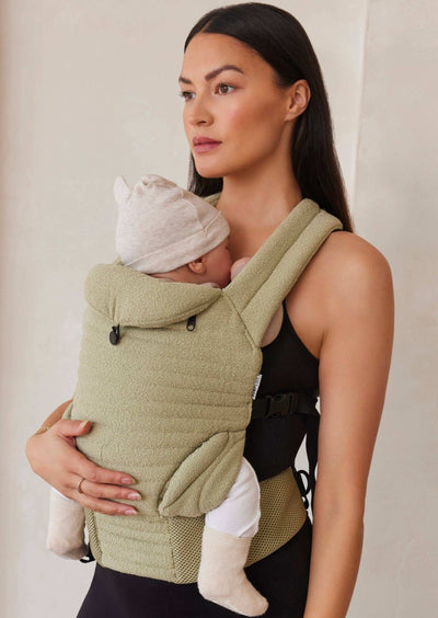 The Armadillo Baby Carrier in matcha green color, designed for comfortable and stylish babywearing