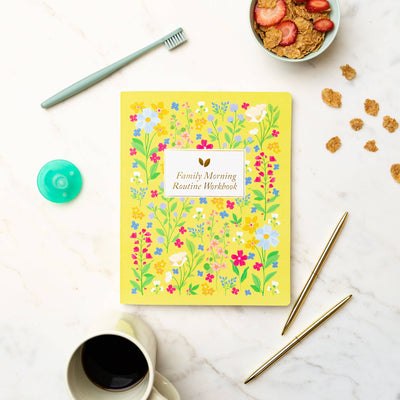 A family gathers around the table, using the Family Morning Routine Workbook