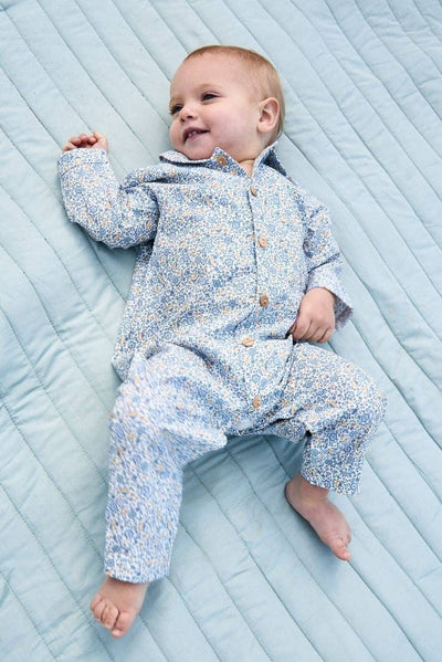 Stylish and elegant blue liberty floral romper with a flattering silhouette