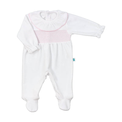 Adorable white velour footie with pink smocked detailing for babies