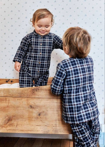 Adorable navy plaid flannel romper for infants, perfect for keeping your little one cozy and stylish