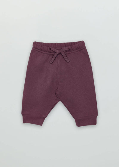 Soft and comfortable plum baby sweatpants with elastic waistband and ribbed cuffs