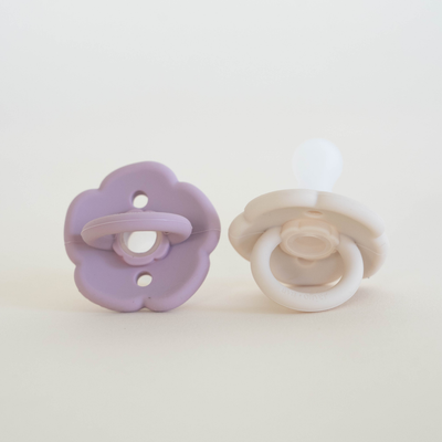 Flower pacifier set in lavender and sand colors for babies